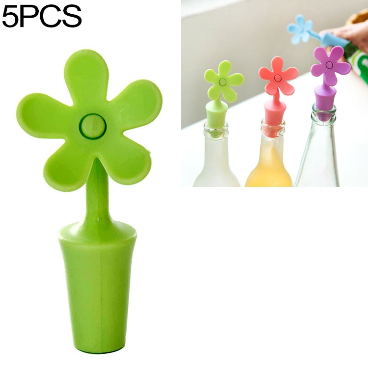 Green flower-shaped silicone bottle stopper with round seal opening on a stem