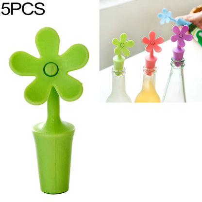 Green flower-shaped silicone bottle stopper with round seal opening on a stem