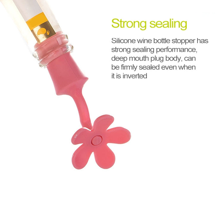 Red flower-shaped silicone bottle stopper sealing a bottle neck