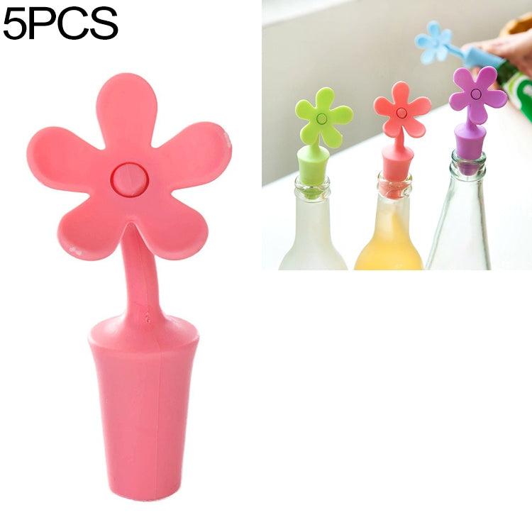 Pink/red flower-shaped silicone bottle stopper with round seal opening on a stem