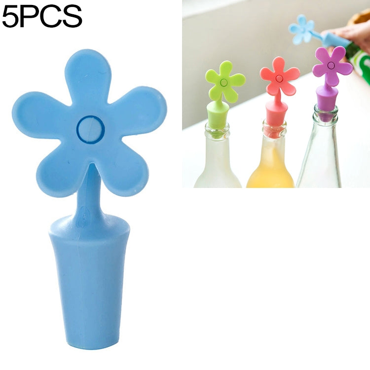 Blue flower-shaped silicone bottle stopper with round seal opening on a stem
