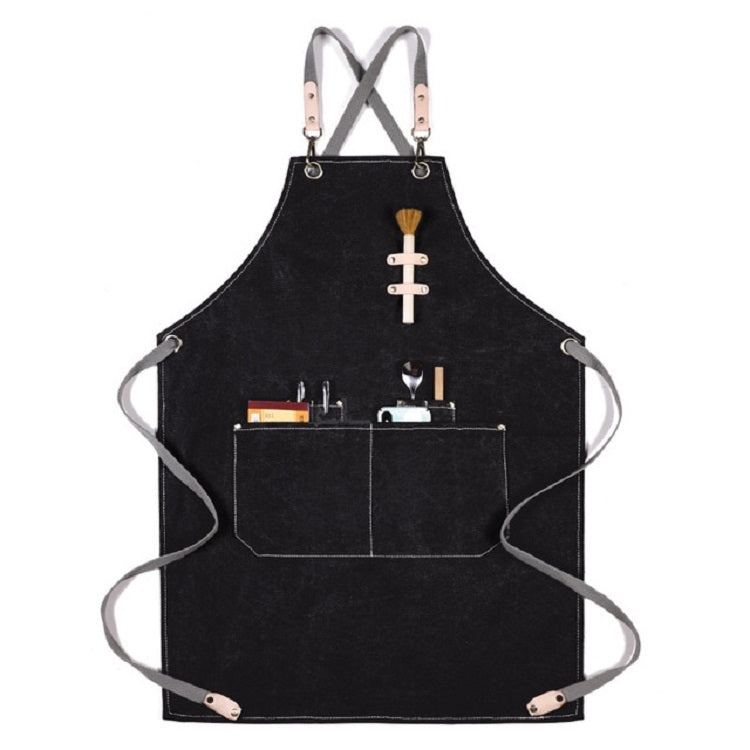 Black thick canvas apron with X-back straps, front tool pockets, and hanging loops