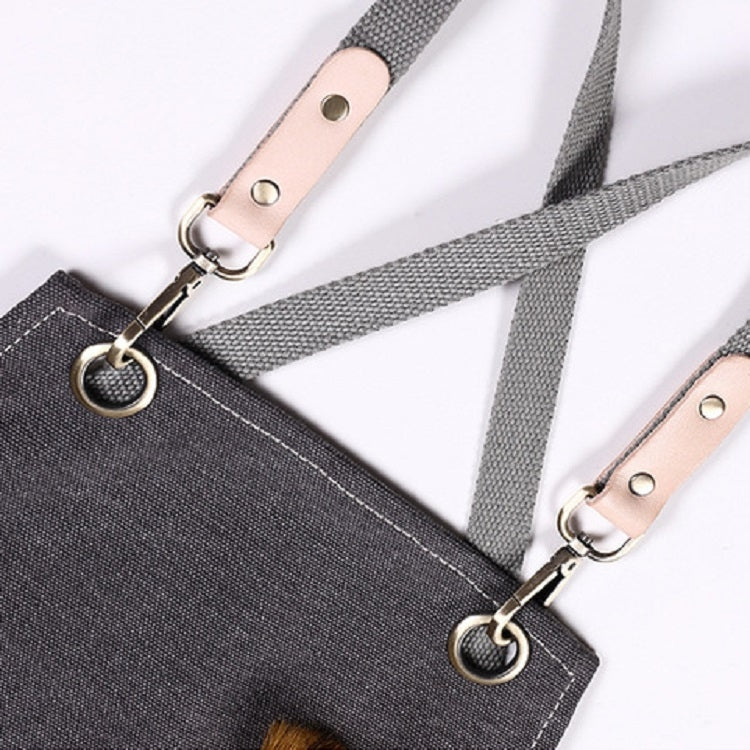 Dark grey canvas apron straps with tan leather connector tabs and metal grommets