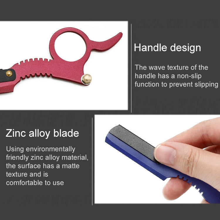 Red thumb razor with black blade insert, serrated grip texture, and finger loop.