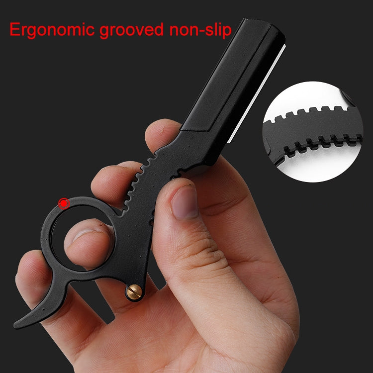 Black ergonomic thumb razor with grooved non-slip grip and round finger loop.