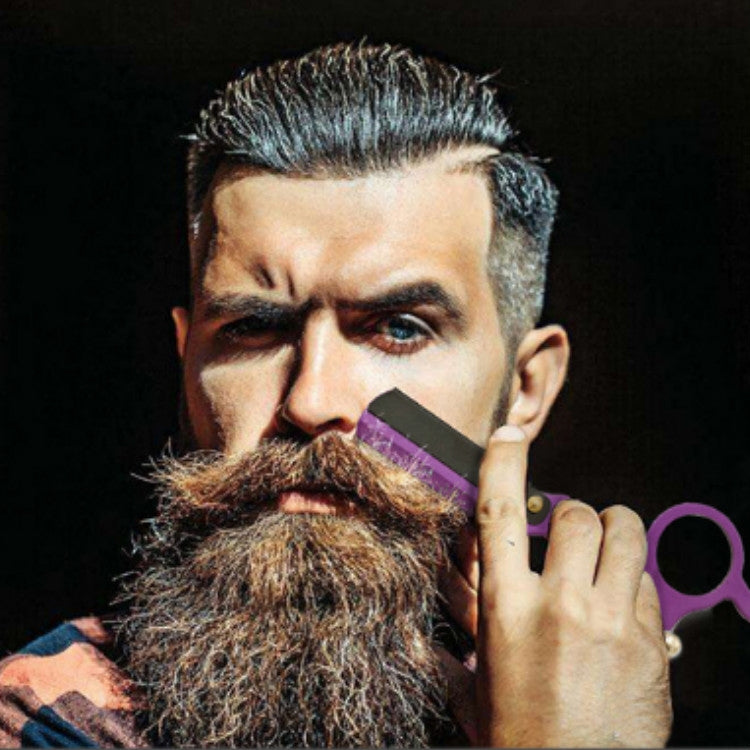 Purple thumb razor shown held near a beard, with black blade guard and finger loop.