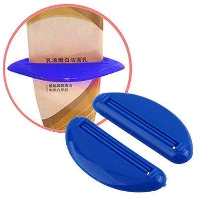 Blue toothpaste squeeze tool with ridged press, oval handle for tube dispensing