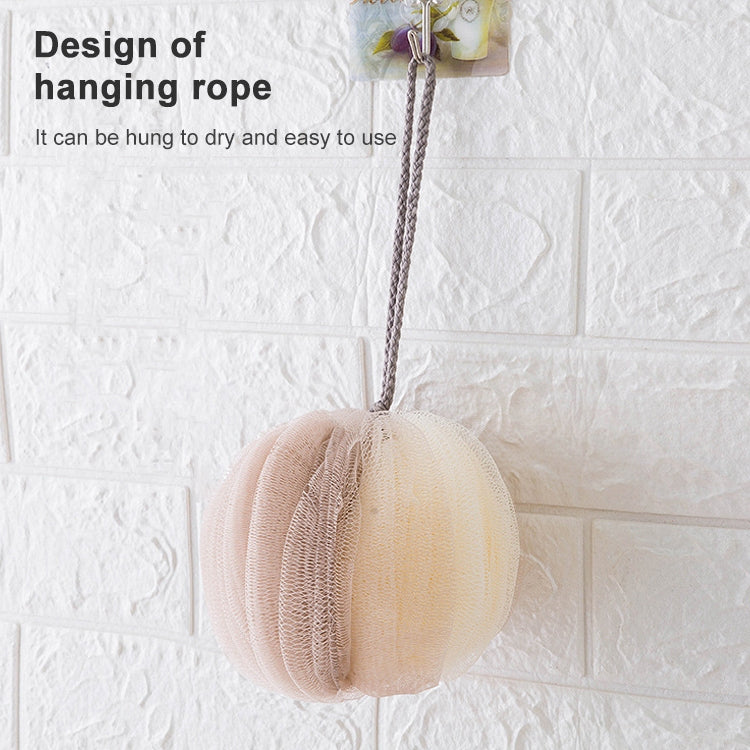 Beige mesh bath sponge lantern hanging on a rope