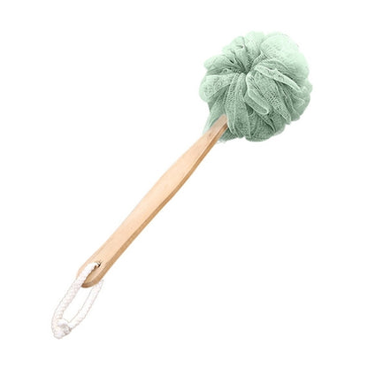 Green soft mesh body shower brush with long wooden handle and hanging loop.