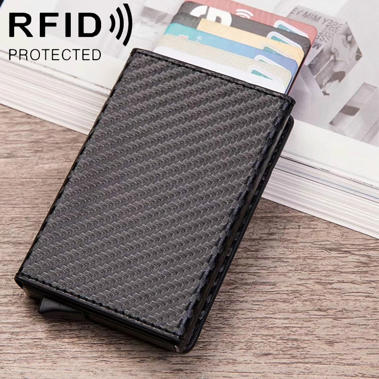 Magnetic RFID credit card case with carbon-fiber texture, holding cards in an open slot