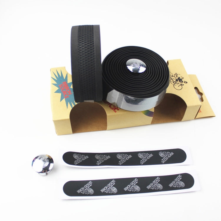 Set of black handlebar tapes with patterned grip texture and included tape rolls