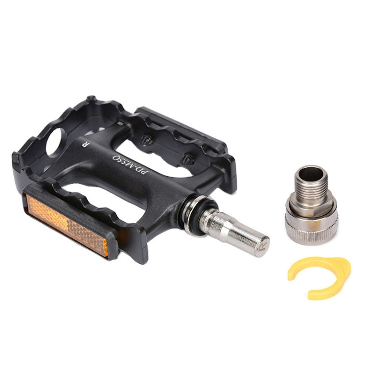 Black bike pedal with orange reflector, silver axle, and separate threaded cap