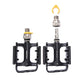 Two black bike pedals with orange reflectors and yellow quick-release levers