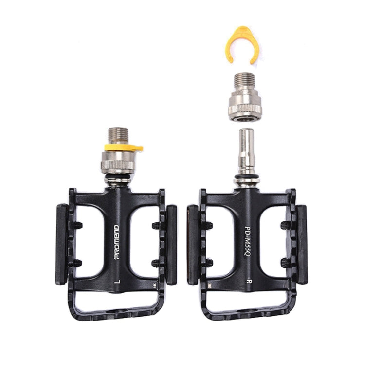 Two black bike pedals with orange reflectors and yellow quick-release levers