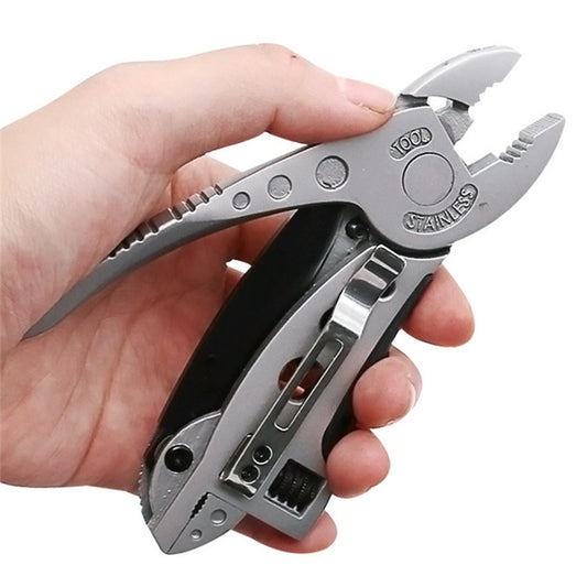 Multifunction camping pliers with metal jaws and built-in wrench, held in hand