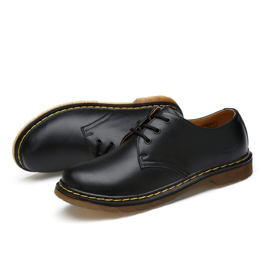 Black leather lace-up casual boots, side view with thick sole and yellow stitching