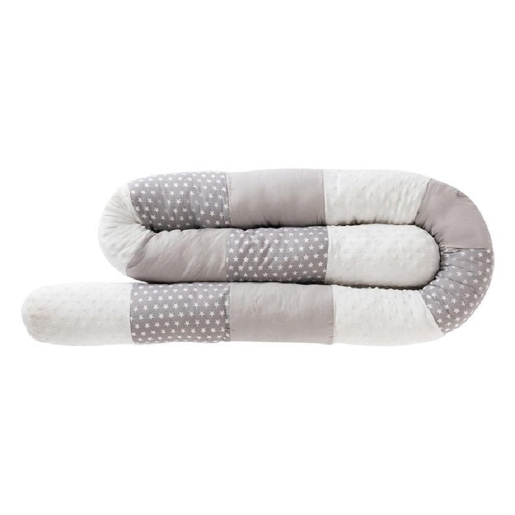 Cylindrical crib bumper with gray star fabric and light padding panels