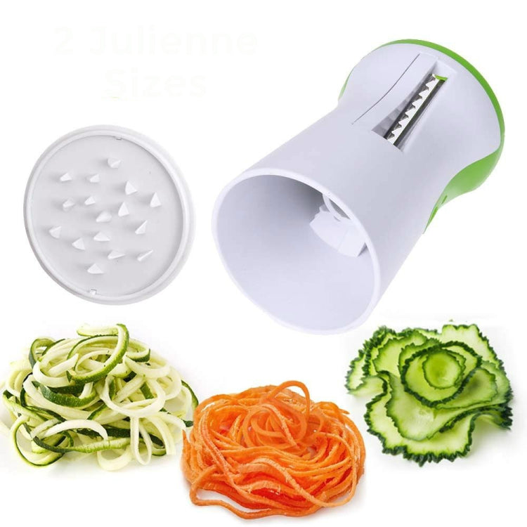 White and green spiral grater with round disc plate, showing veggie ribbon cuts.