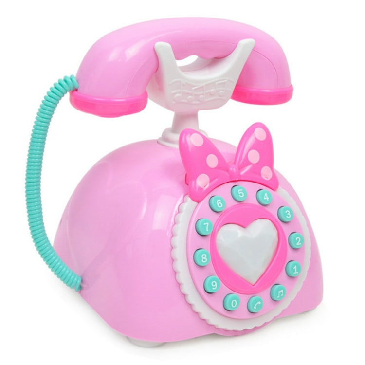 Pink retro musical telephone toy front view with heart dial and teal numbered buttons