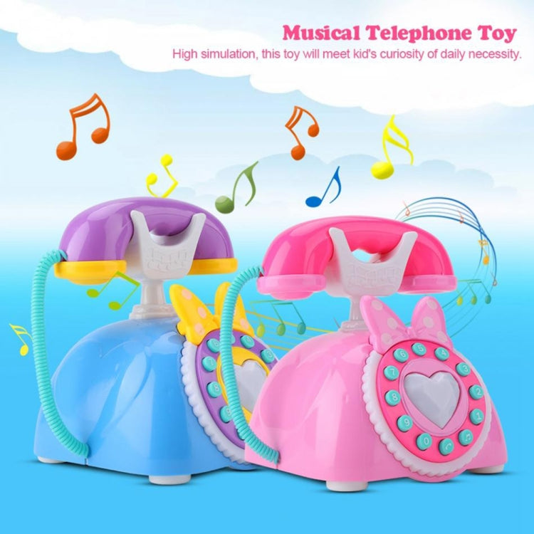 Pink and blue musical telephone toys with heart dial, teal cord, and speaker handset