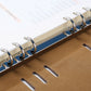 Loose-leaf notepad inner notebook, blue open pages with metal ring binder and spine cutouts