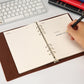 Loose-leaf business notepad inner notebook, open lined pages with metal rings and pen