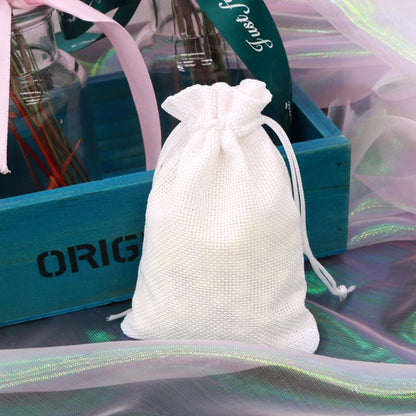 White linen drawstring gift bag with gathered top and braided rope ties.