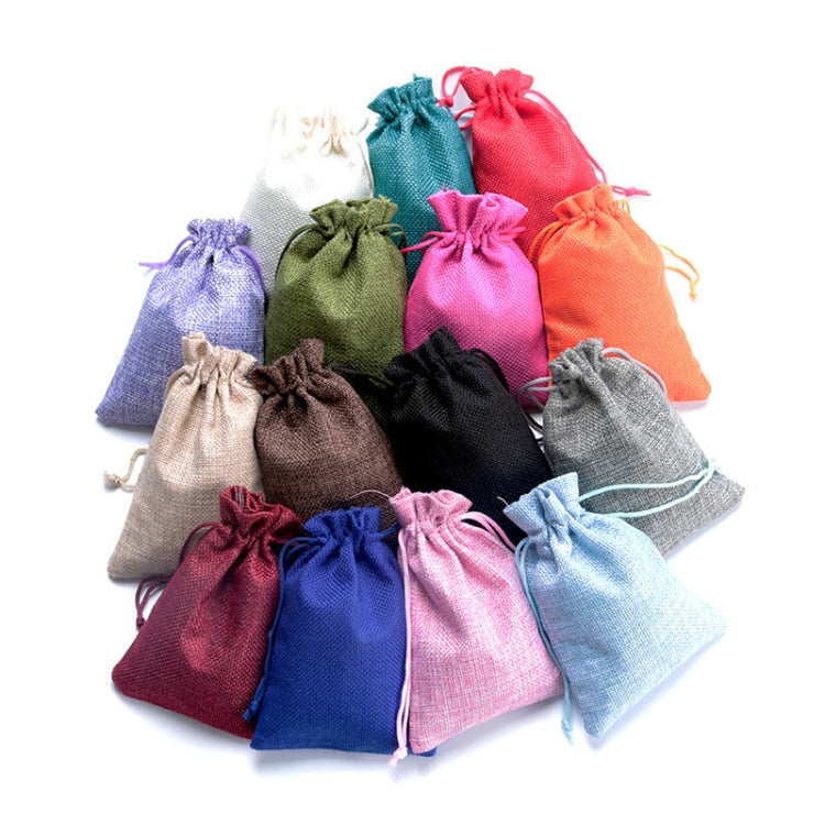 Colorful set of linen drawstring gift bags with rope drawstring closures.