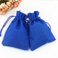 Royal blue linen drawstring gift bag set, two pouches with knotted cords.