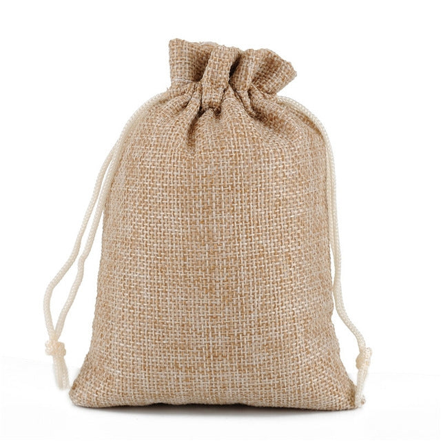 Linen jute drawstring gift bag in beige, gathered top with white drawstring cords