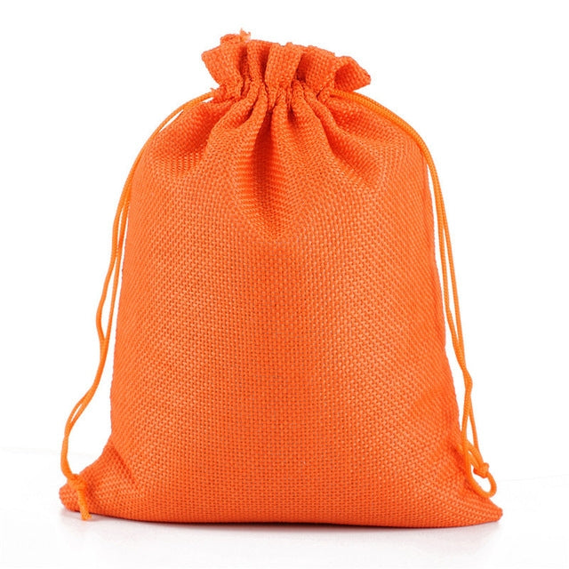 Linen jute drawstring gift bag in orange, gathered top with matching drawstring cords