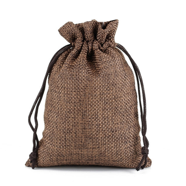 Linen jute drawstring gift bag in dark brown, gathered top with black drawstring cords