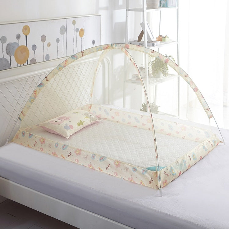 Children’s baby dome mosquito net with pastel animal print bedding, on a bed frame