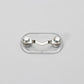 Clear oval magnetic glasses holder with silver end caps and decorative details