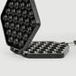 Open non-stick egg puff mold tray with round cavities on hinged pan