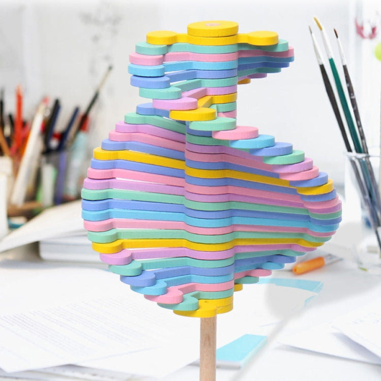 Rainbow striped stacked-disc lollipop decompression toy on a round wooden base