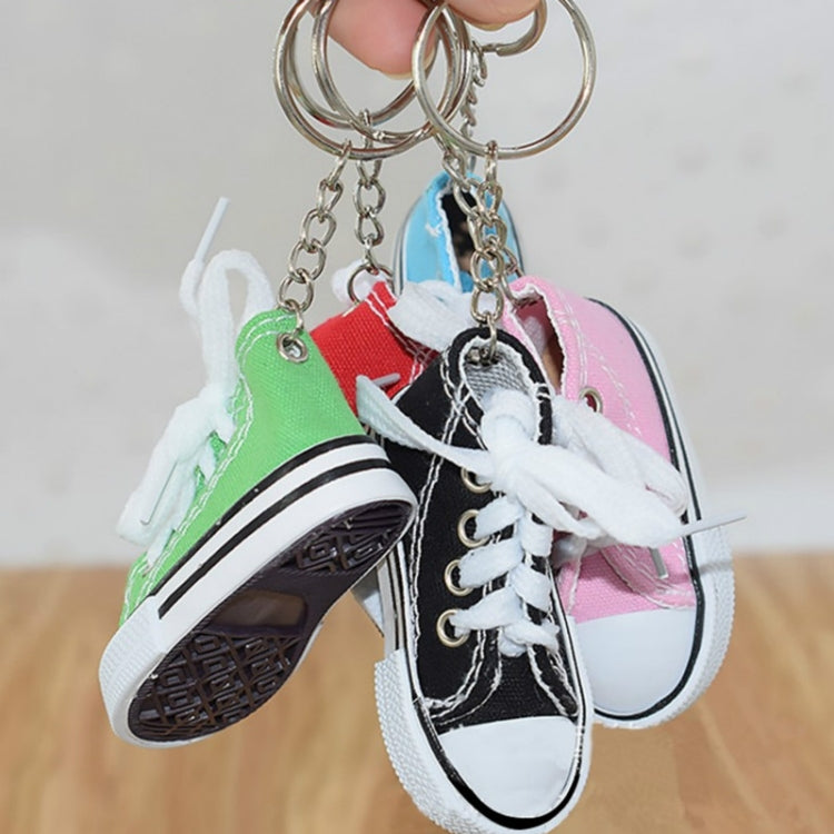 Assorted mini canvas sneaker keychains with laces and metal key rings