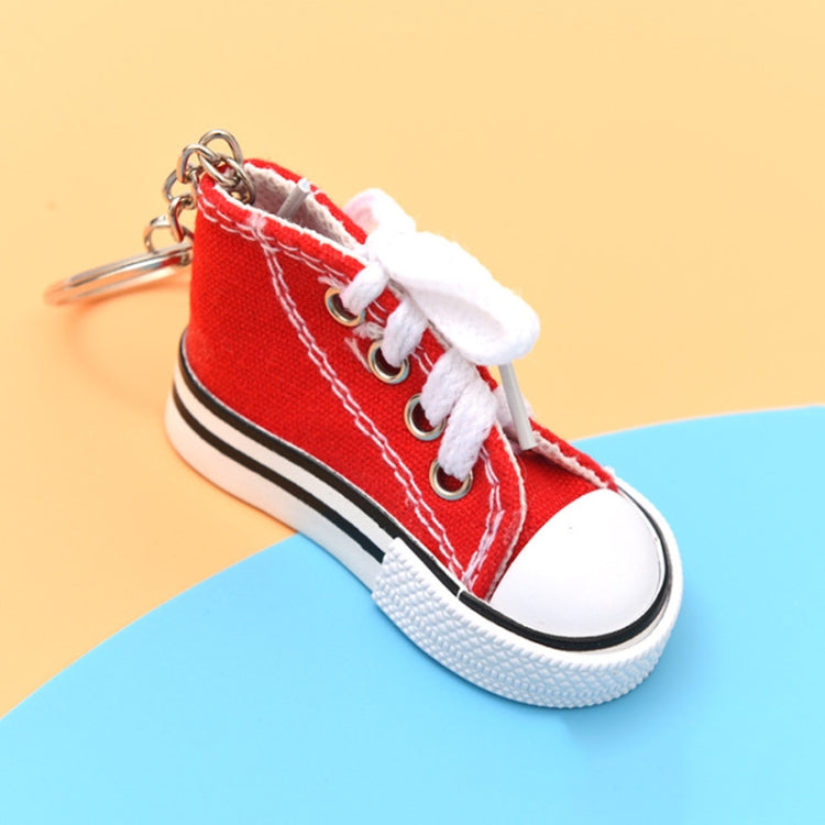 Red mini canvas sneaker keychain with white laces and metal key ring