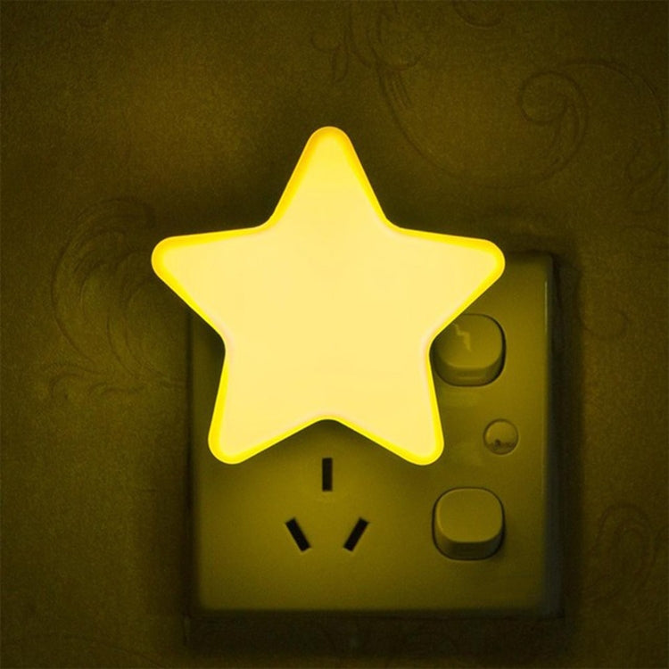 Yellow star-shaped LED night light with wall plug and light sensor control