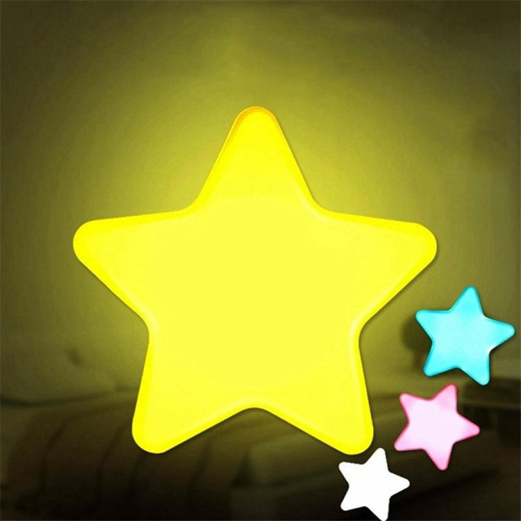 Star-shaped LED night light with bright yellow glow and nearby blue, pink, and white stars