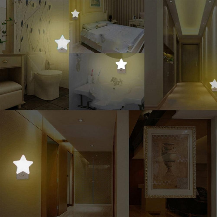 Star-shaped LED night light with several small white glowing stars on interior walls