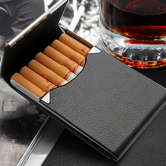 Open charcoal-gray slim cigarette case holding cigarettes with orange tips