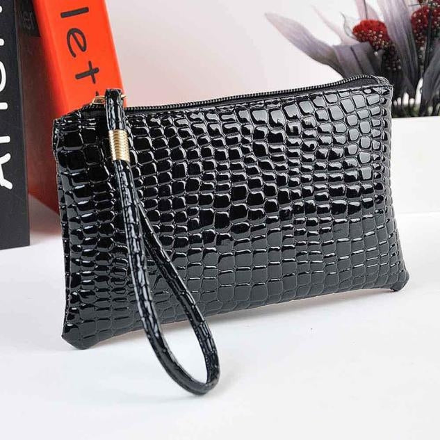 Black crocodile-pattern ladies clutch wallet with wrist strap and zip closure