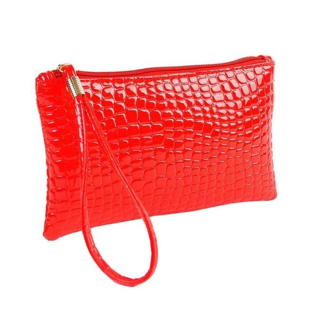 Red crocodile-pattern ladies clutch wallet with wrist strap and zip closure