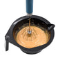 Egg beater whisk mixing batter in a bowl