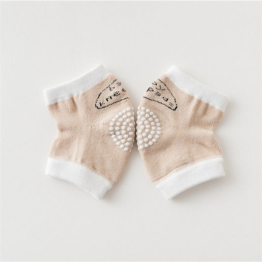 Khaki cotton baby knee pads with non-slip dotted grip and white cuffs