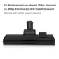 Black floor vacuum brush head with upright connector and textured side pad