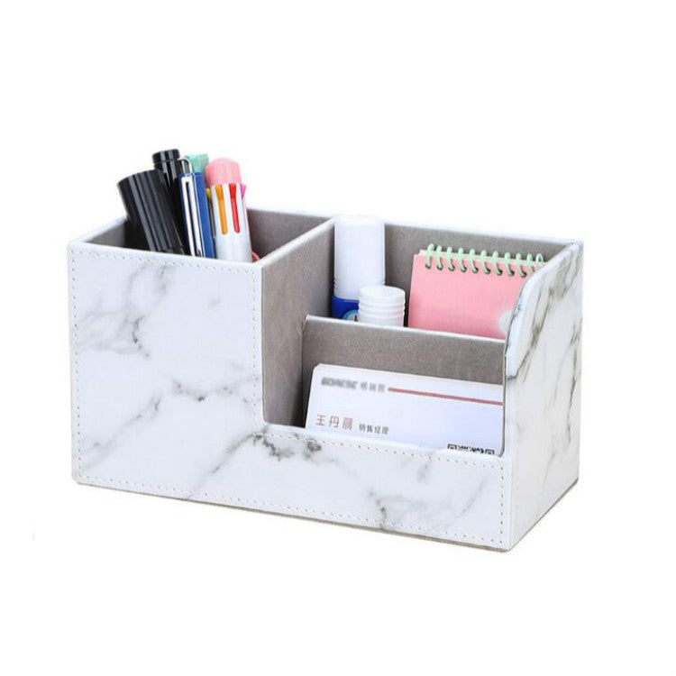 Marble-pattern multi-compartment pen holder with notebook and pen slots, white.