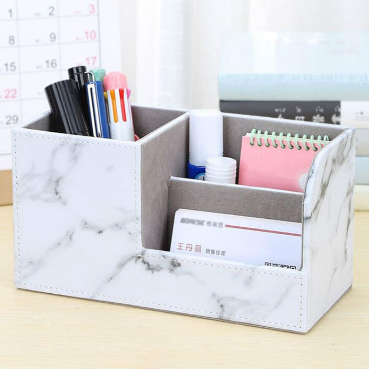 White marble-pattern desk pen organizer with multi slots holding pens, cards, and notes.