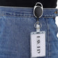 Clear vertical ID badge holder clipped to a belt loop with a black retractable cord and tag
